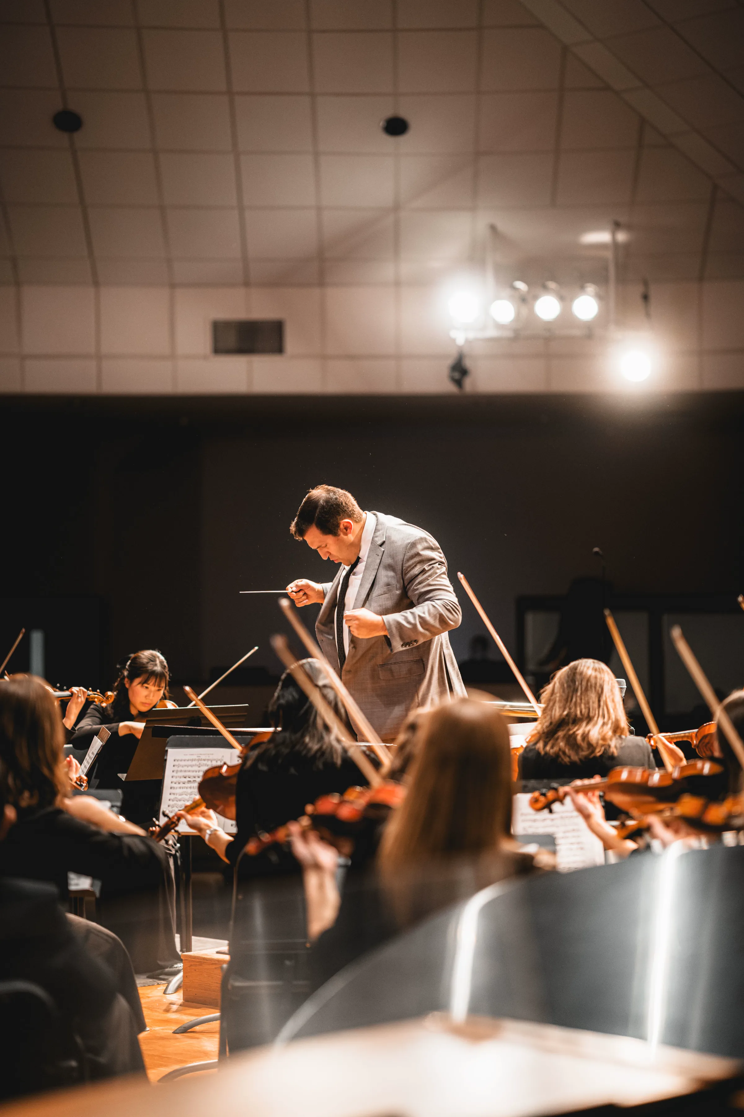 Conductor leading an orchestra